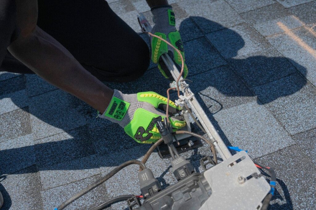 The Art of Drawing Readers In: Your attractive post title goes here Close-up of a technician working on solar panel installation with green gloves in Tampa, Florida.